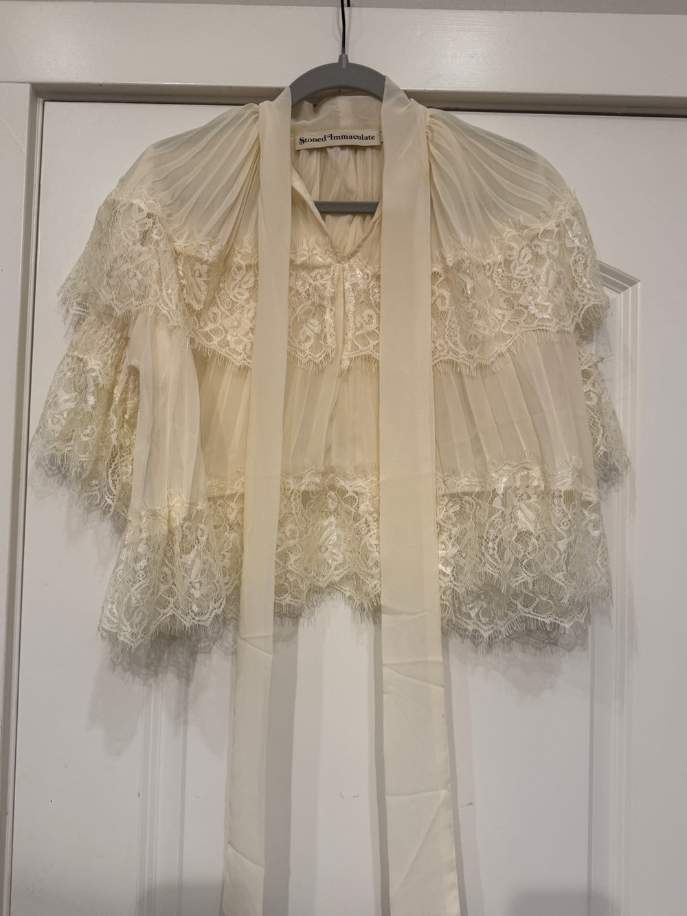 Stoned immaculate capelet top